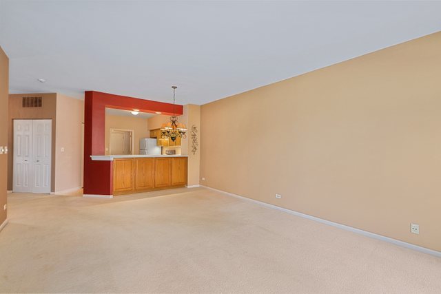 8171 Ripple Ridge Darien, IL 60561 - Photo 8 of 25 a view of a livingroom with wooden floor and a large window