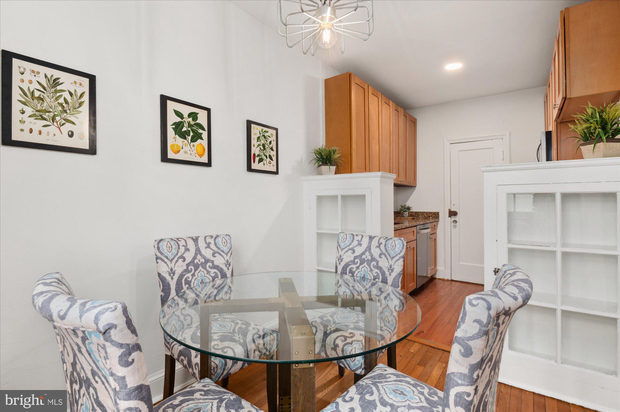 2032 Belmont Road Northwest, Unit 603 Washington, DC 20009 - Photo 9 of 16 a living room with furniture and a table