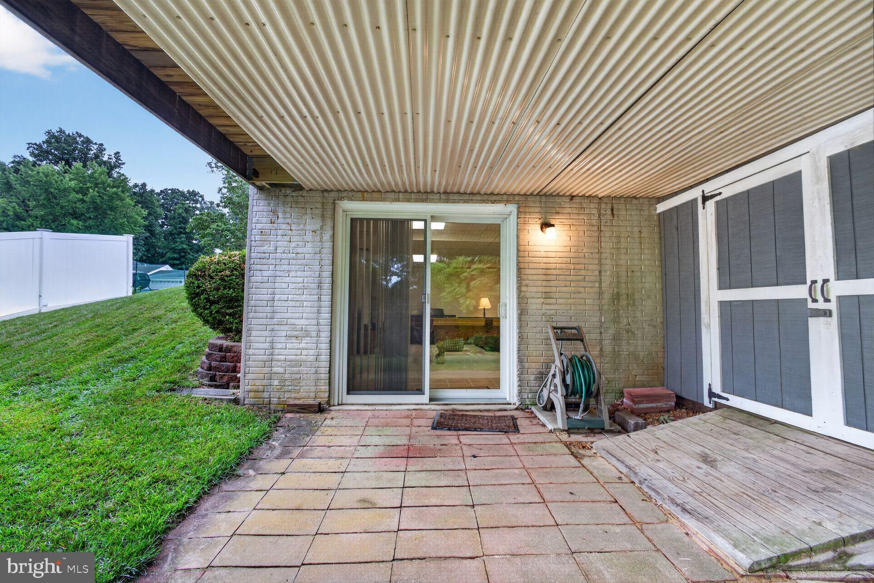 6130 Snowdens Run Road Eldersburg, MD 21784 - Photo 29 of 33 lower level covered patio and shed.
