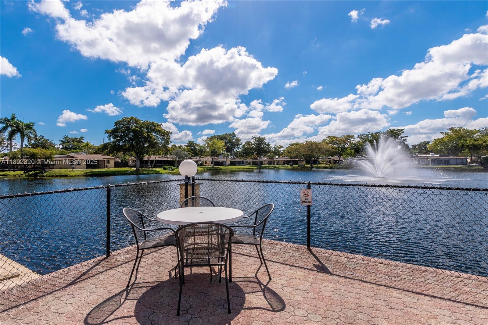 351 Cambridge Road, Unit 208 Hollywood, FL 33024 - Photo 1 of 35 a view of a terrace with furniture and a table