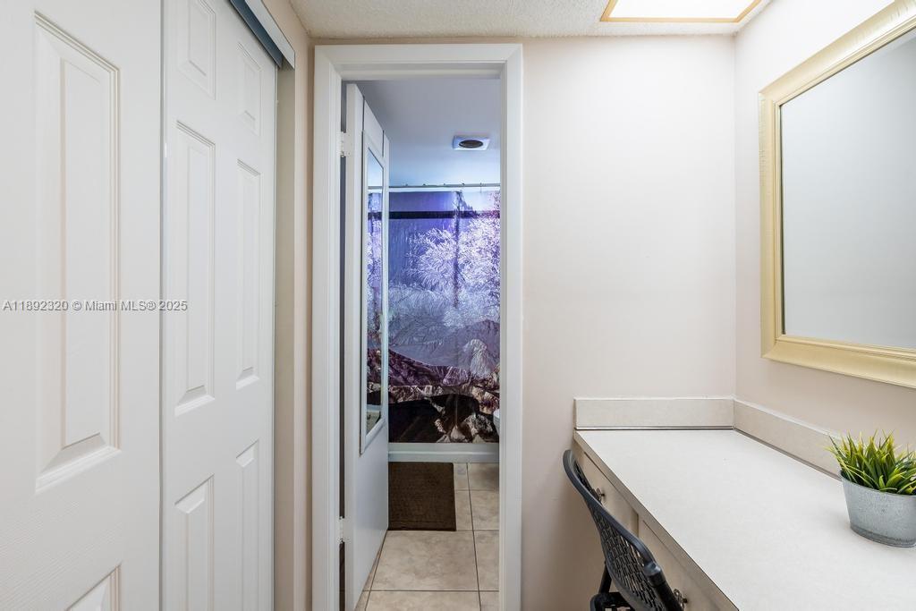 351 Cambridge Road, Unit 208 Hollywood, FL 33024 - Photo 18 of 35 a view of a hallway and an dining rom with furniture
