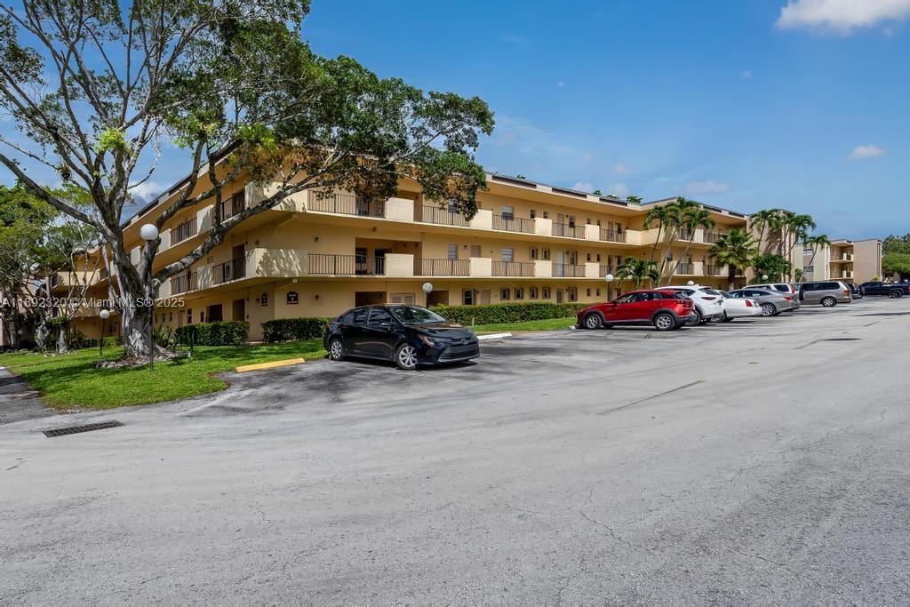 351 Cambridge Road, Unit 208 Hollywood, FL 33024 - Photo 24 of 35 a car parked on the side of the road