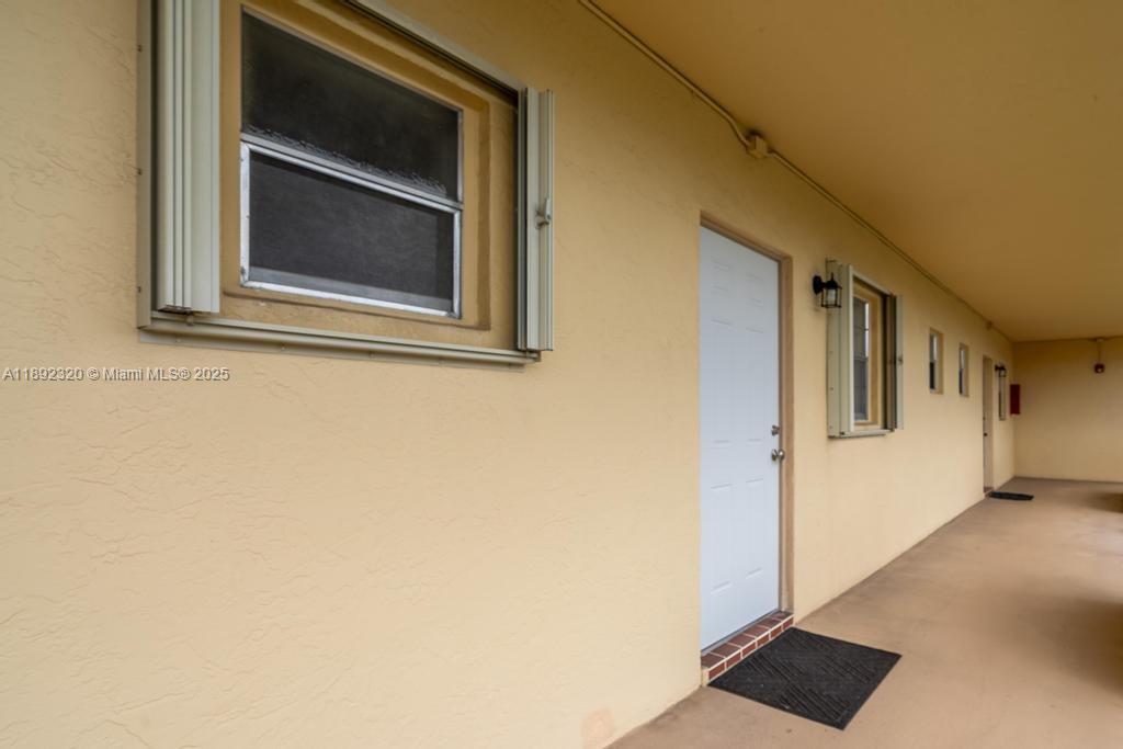 351 Cambridge Road, Unit 208 Hollywood, FL 33024 - Photo 28 of 35 a picture of a door of a house