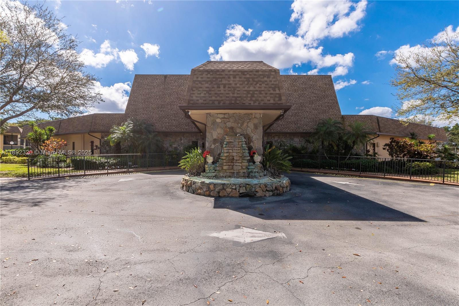 351 Cambridge Road, Unit 208 Hollywood, FL 33024 - Photo 30 of 35 a view of a yard with a fountain