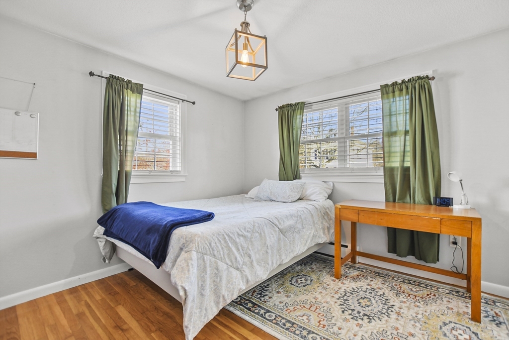 118 1/2 Market Street, Unit 118 1/2 Amesbury, MA 01913 - Photo 12 of 37 a bedroom with a bed and a window