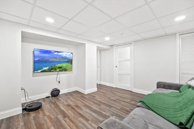 a room with furniture and a flat screen tv