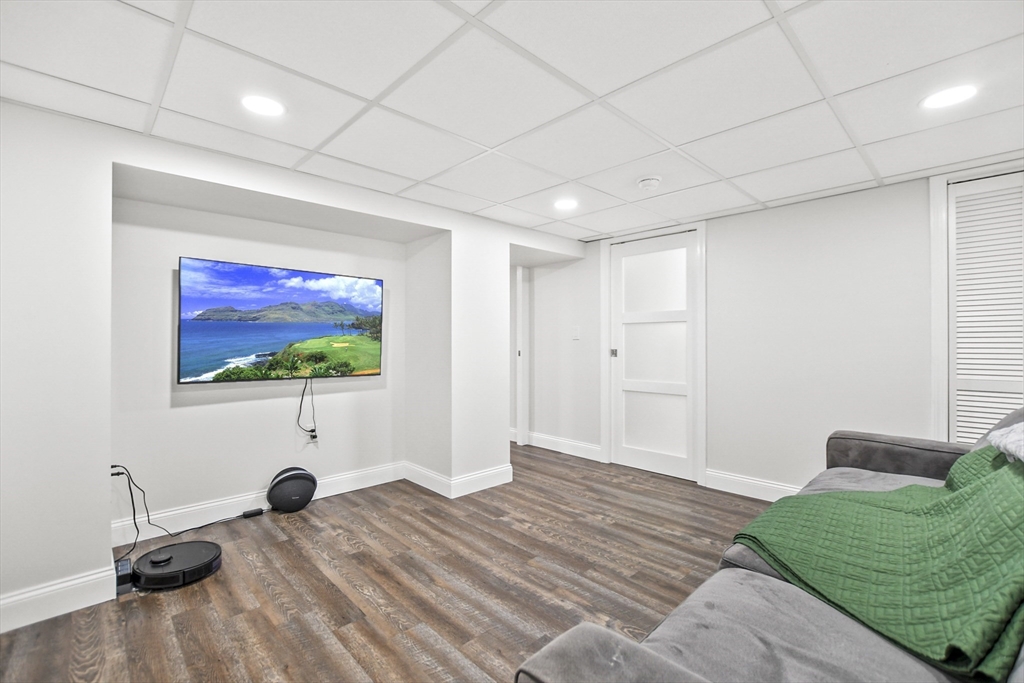 118 1/2 Market Street, Unit 118 1/2 Amesbury, MA 01913 - Photo 24 of 37 a room with furniture and a flat screen tv