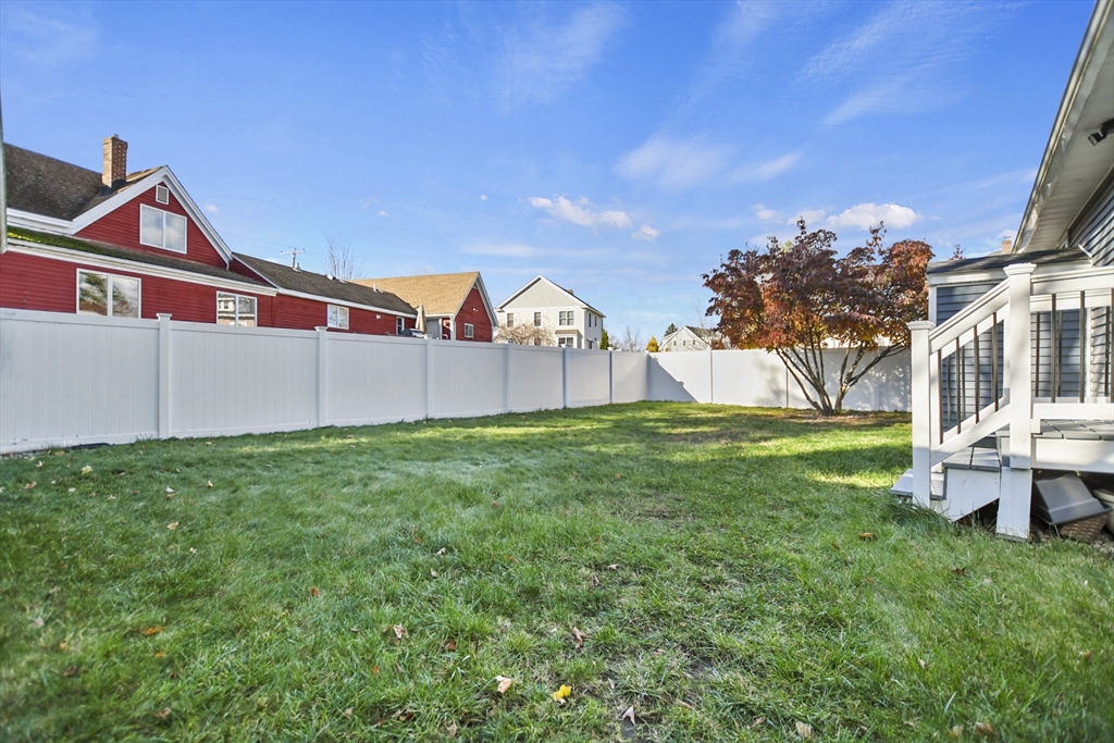 118 1/2 Market Street, Unit 118 1/2 Amesbury, MA 01913 - Photo 26 of 37 a view of backyard with deck and garden
