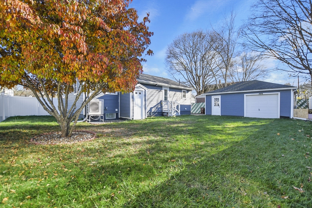 118 1/2 Market Street, Unit 118 1/2 Amesbury, MA 01913 - Photo 29 of 37 a brick house with a big yard large trees