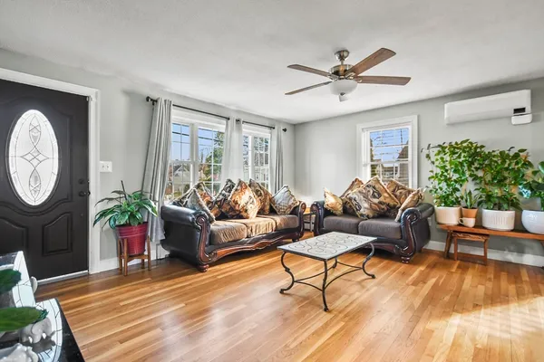 a living room with furniture and a window