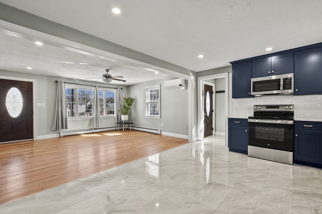 118 1/2 Market Street, Unit 118 1/2 Amesbury, MA 01913 - Photo 6 of 37 a kitchen with stainless steel appliances granite countertop a refrigerator and a stove top oven