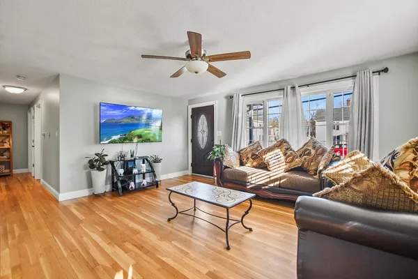a living room with furniture and a flat screen tv