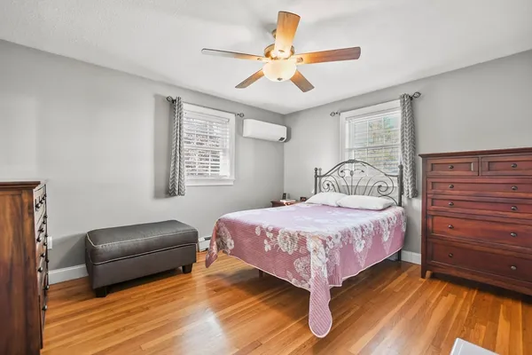 a bedroom with a bed and window