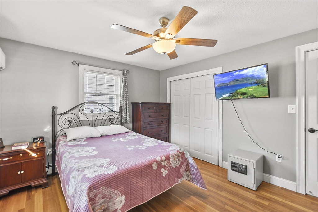 118 1/2 Market Street, Unit 118 1/2 Amesbury, MA 01913 - Photo 10 of 37 a bedroom with a bed and a flat screen tv