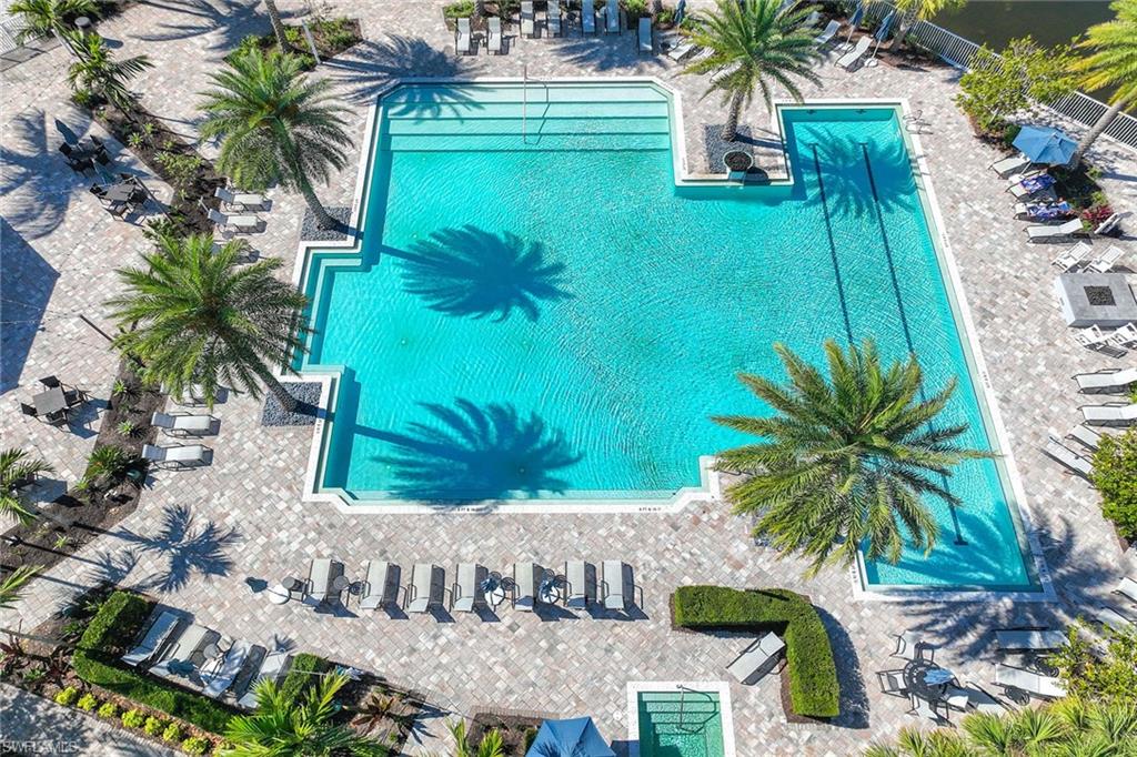 9309 Surfbird Court Naples, FL 34120 - Photo 34 of 45 Community pool featuring a patio