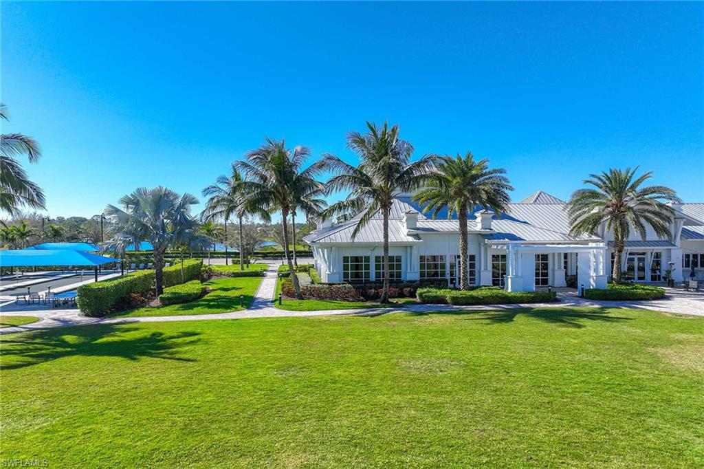 9309 Surfbird Court Naples, FL 34120 - Photo 38 of 45 View of property's community featuring a yard