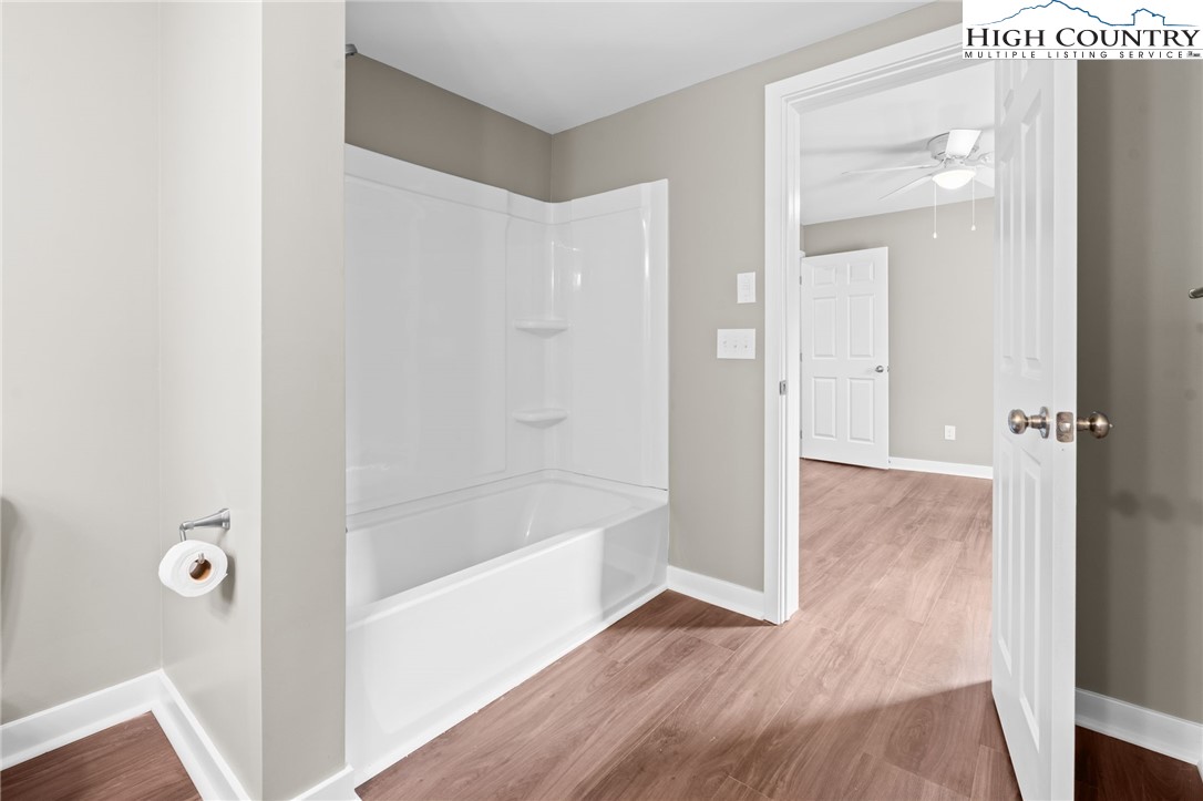 2015 Highway 194 Boone, NC 28607 - Photo 12 of 40 a bathroom with a bathtub and shower