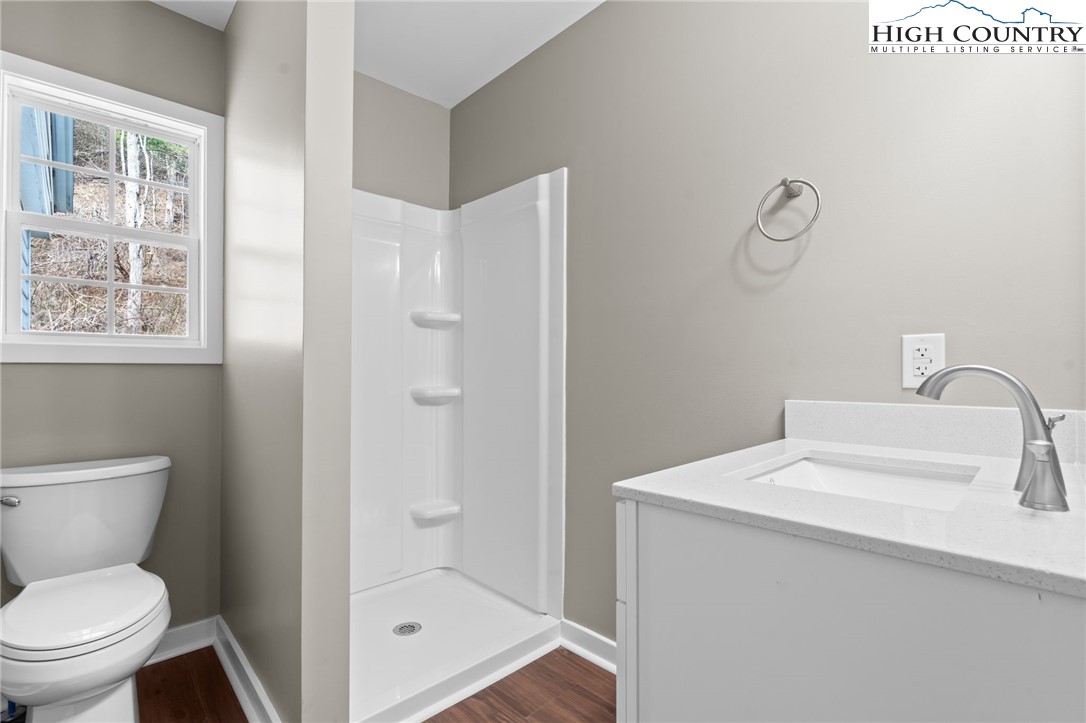 2015 Highway 194 Boone, NC 28607 - Photo 15 of 40 a bathroom with a toilet sink and shower