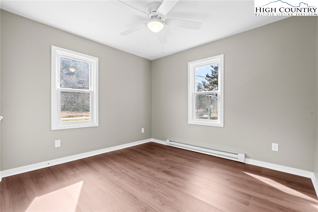2015 Highway 194 Boone, NC 28607 - Photo 17 of 40 a view of an empty room with wooden floor and a window