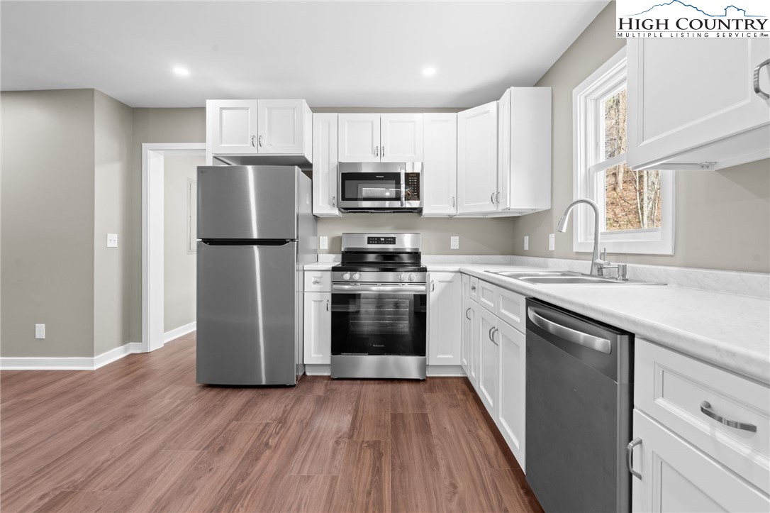 2015 Highway 194 Boone, NC 28607 - Photo 4 of 40 a kitchen with cabinets stainless steel appliances a sink and a window