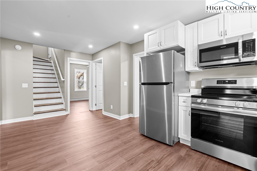 2015 Highway 194 Boone, NC 28607 - Photo 5 of 40 a kitchen with stainless steel appliances a refrigerator microwave and stove