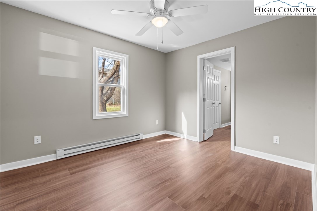 2015 Highway 194 Boone, NC 28607 - Photo 9 of 40 a view of an empty room with wooden floor and a window