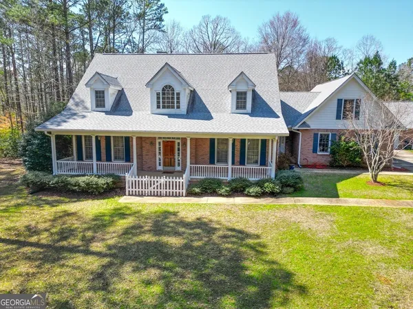 a front view of a house with swimming pool