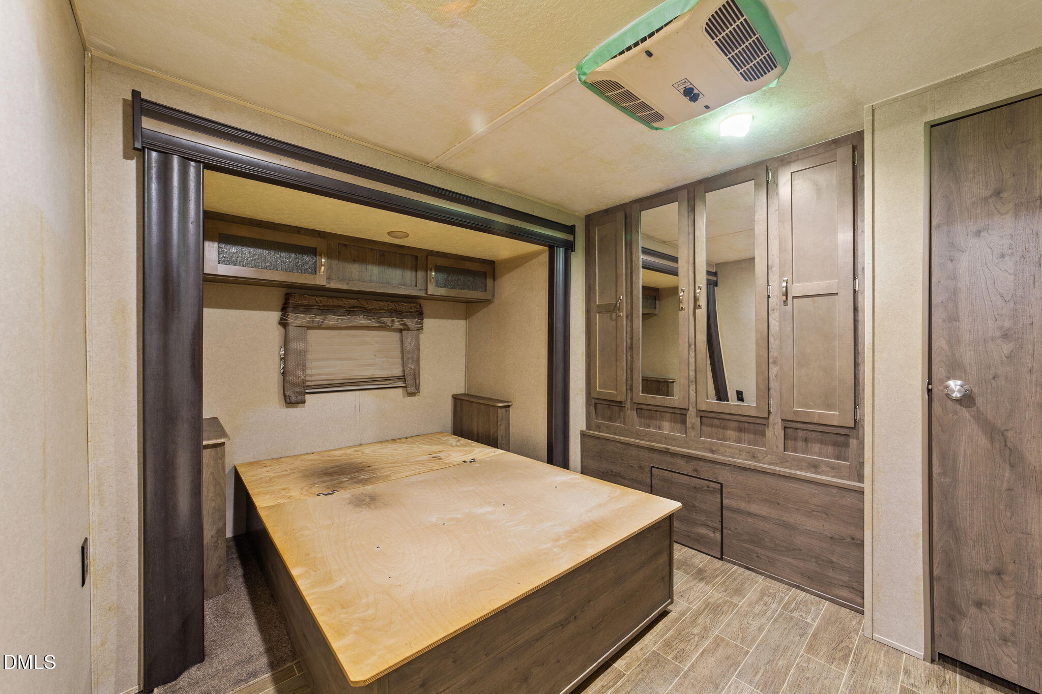 108 Poteau Drive Spring Hope, NC 27882 - Photo 12 of 28 a bedroom with a bed and a large mirror