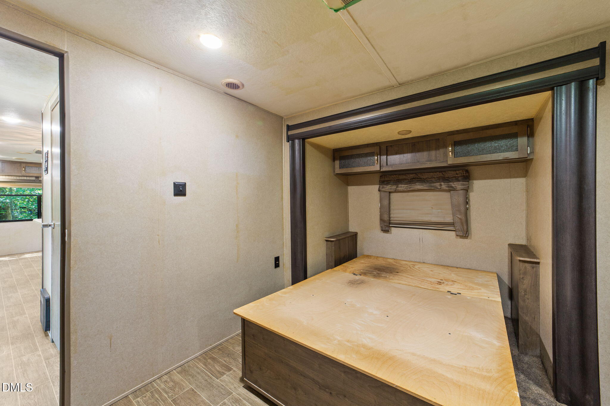 108 Poteau Drive Spring Hope, NC 27882 - Photo 13 of 28 a bedroom with a bed and a window