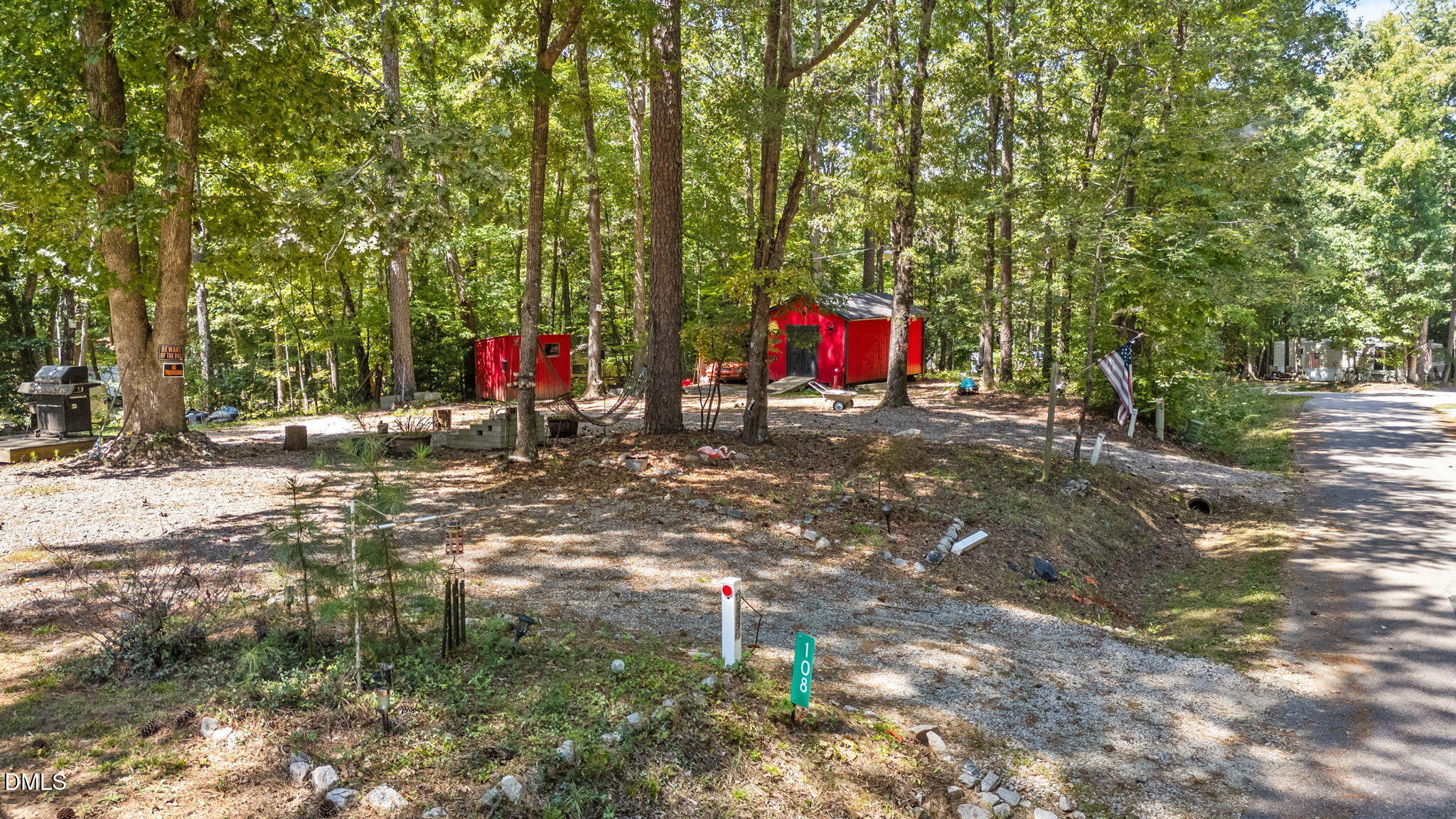 108 Poteau Drive Spring Hope, NC 27882 - Photo 2 of 28 a childrens park with lots of trees and plants