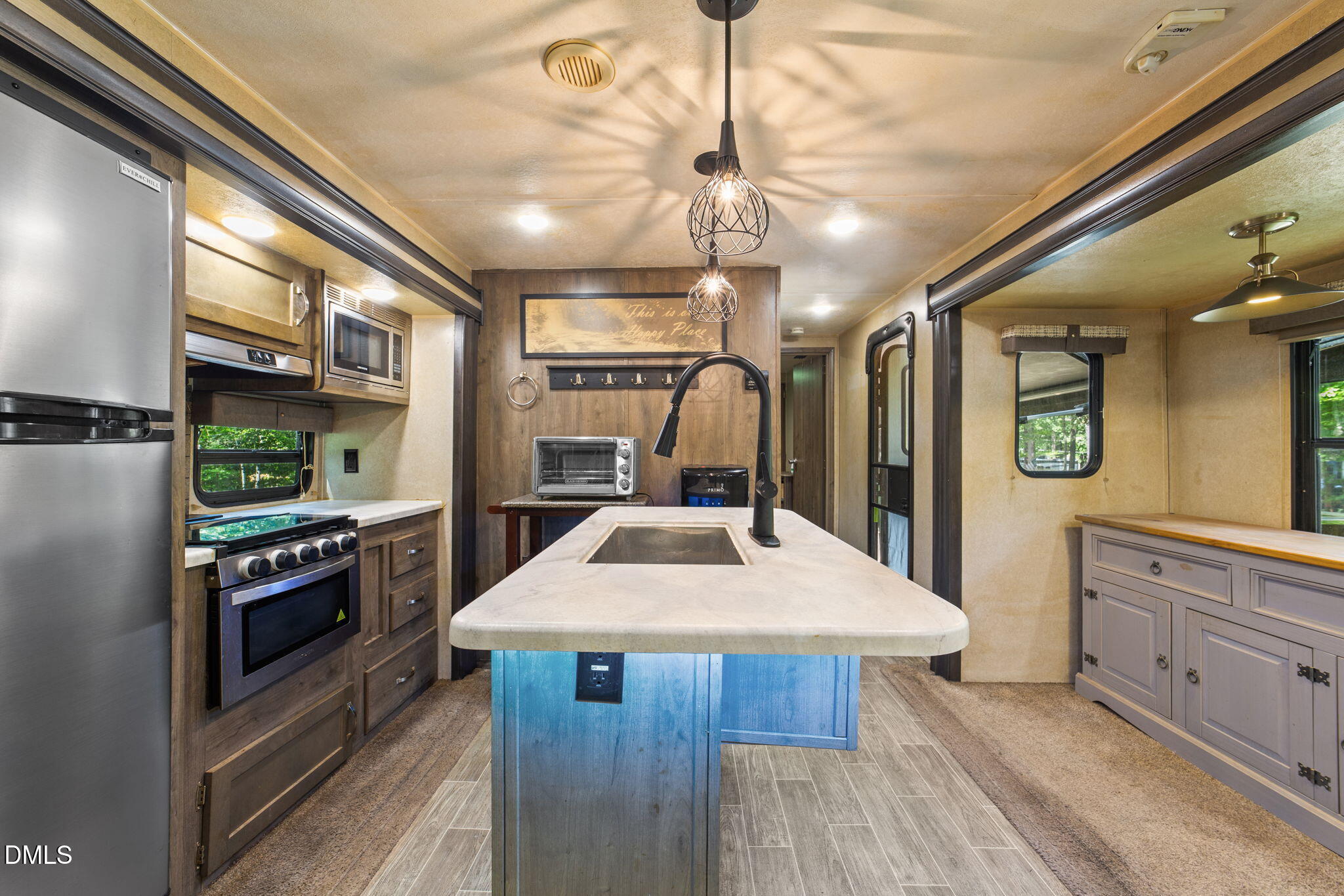 108 Poteau Drive Spring Hope, NC 27882 - Photo 2 of 28 a kitchen with stainless steel appliances a sink and stove