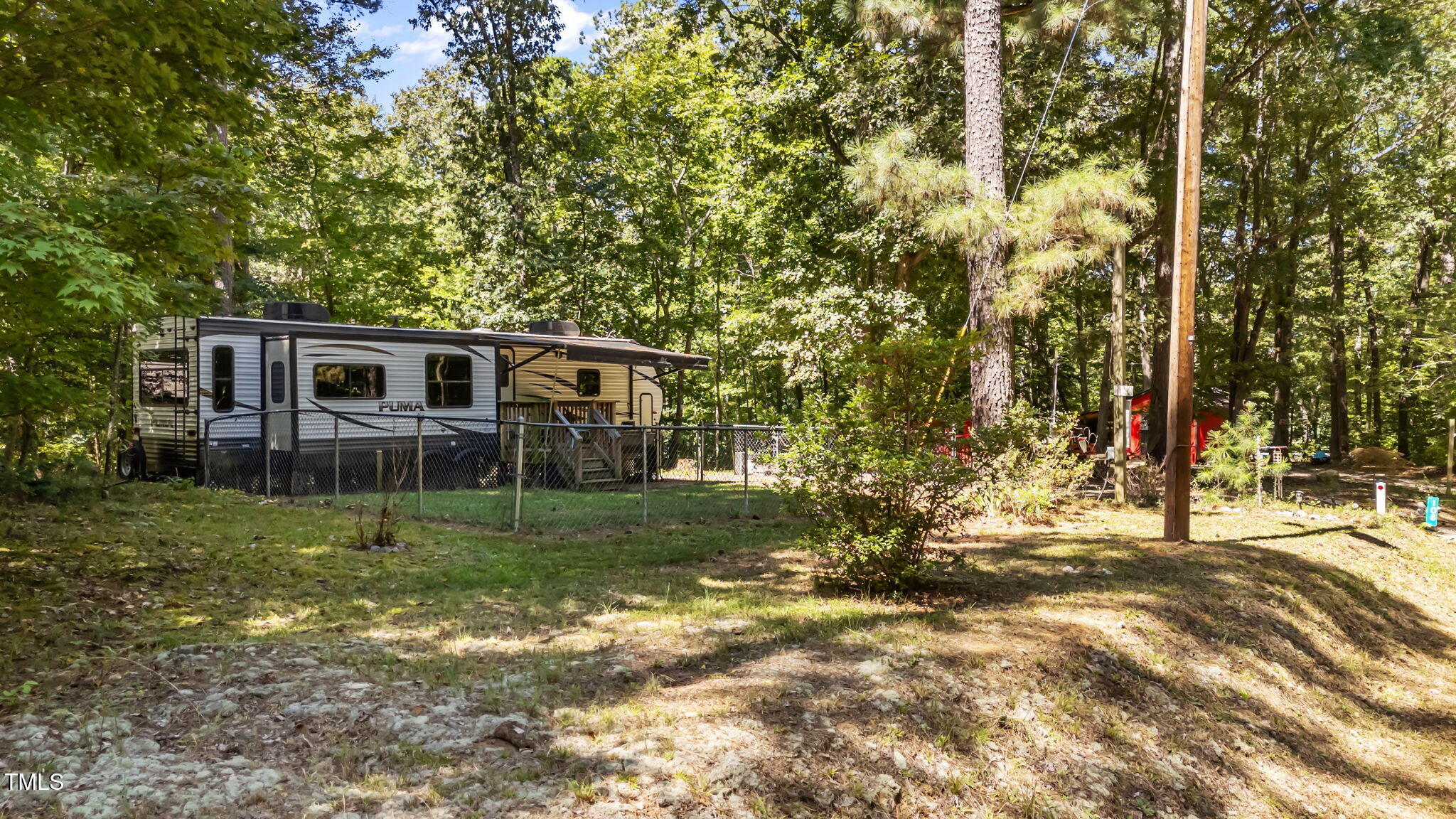 108 Poteau Drive Spring Hope, NC 27882 - Photo 22 of 28 a view of a house with backyard and trees