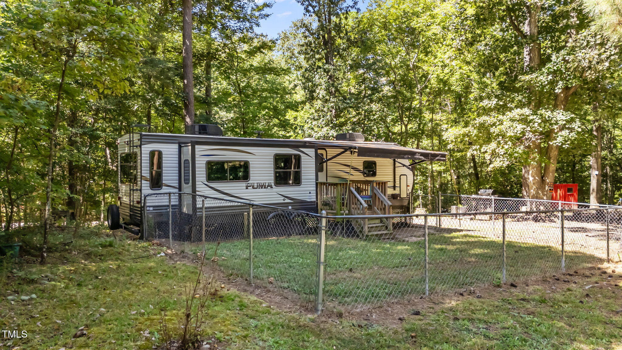 108 Poteau Drive Spring Hope, NC 27882 - Photo 3 of 28 a backyard of a house with table and chairs