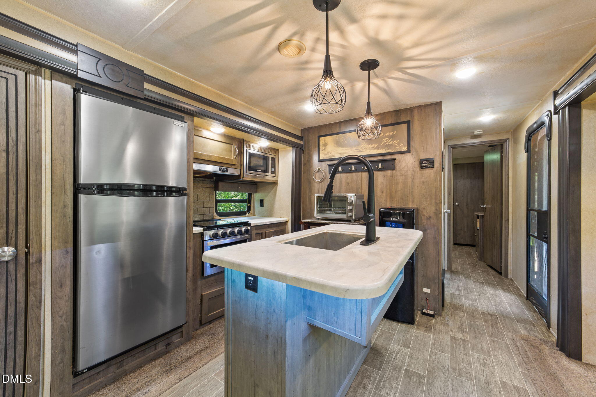 108 Poteau Drive Spring Hope, NC 27882 - Photo 6 of 28 a kitchen with stainless steel appliances granite countertop a refrigerator a sink and a stove