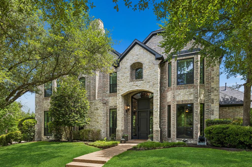 310 Deer Path Fairview, TX 75069 - Photo 1 of 40 a front view of a house with a yard