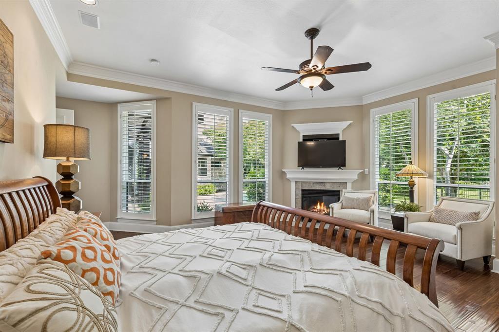310 Deer Path Fairview, TX 75069 - Photo 20 of 40 The oversized primary suite is tucked away with fireplace, sitting area, and expansive closet.