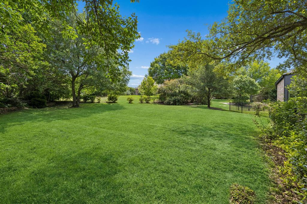 310 Deer Path Fairview, TX 75069 - Photo 2 of 40 a view of a grassy field with trees