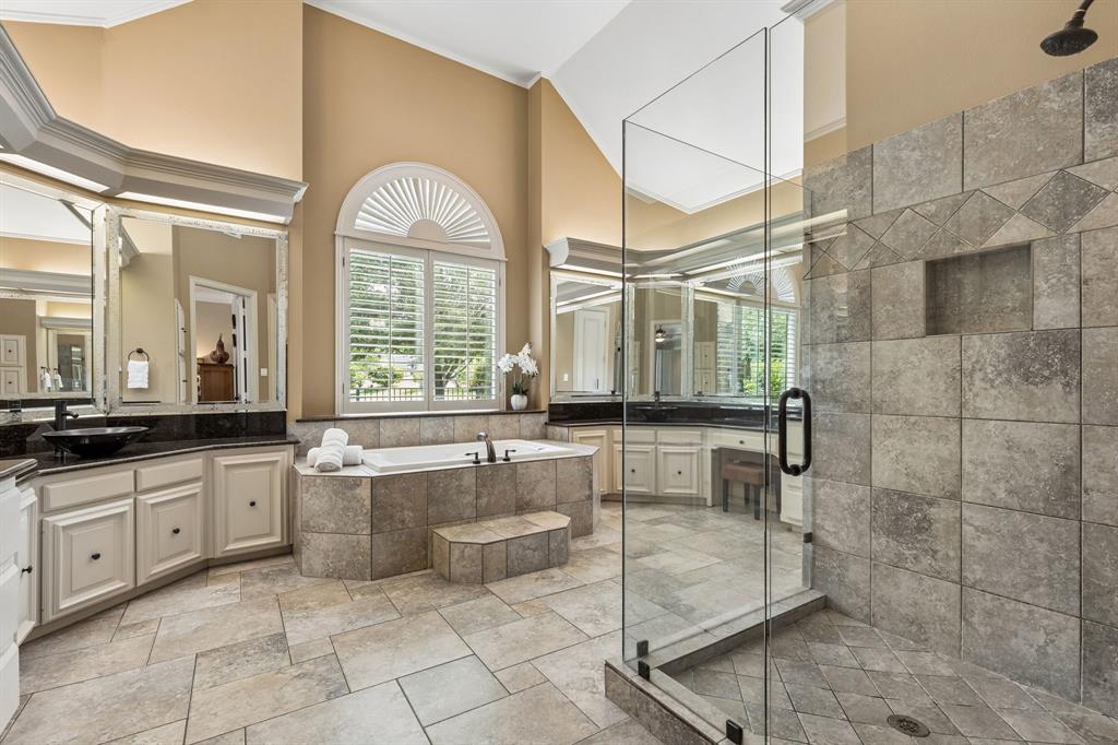 310 Deer Path Fairview, TX 75069 - Photo 22 of 40 a large bathroom with a large tub and sink