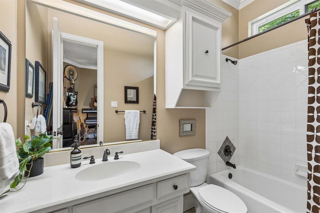 310 Deer Path Fairview, TX 75069 - Photo 27 of 40 a bathroom with a sink toilet tub and shower