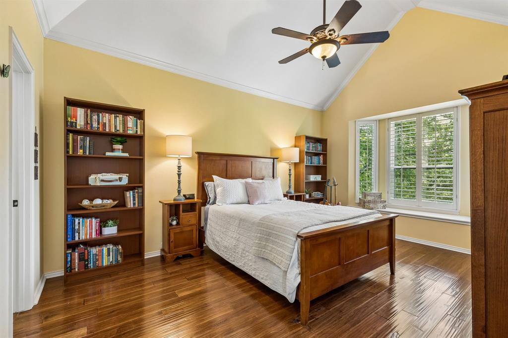 310 Deer Path Fairview, TX 75069 - Photo 28 of 40 a bedroom with a bed furniture and a large window