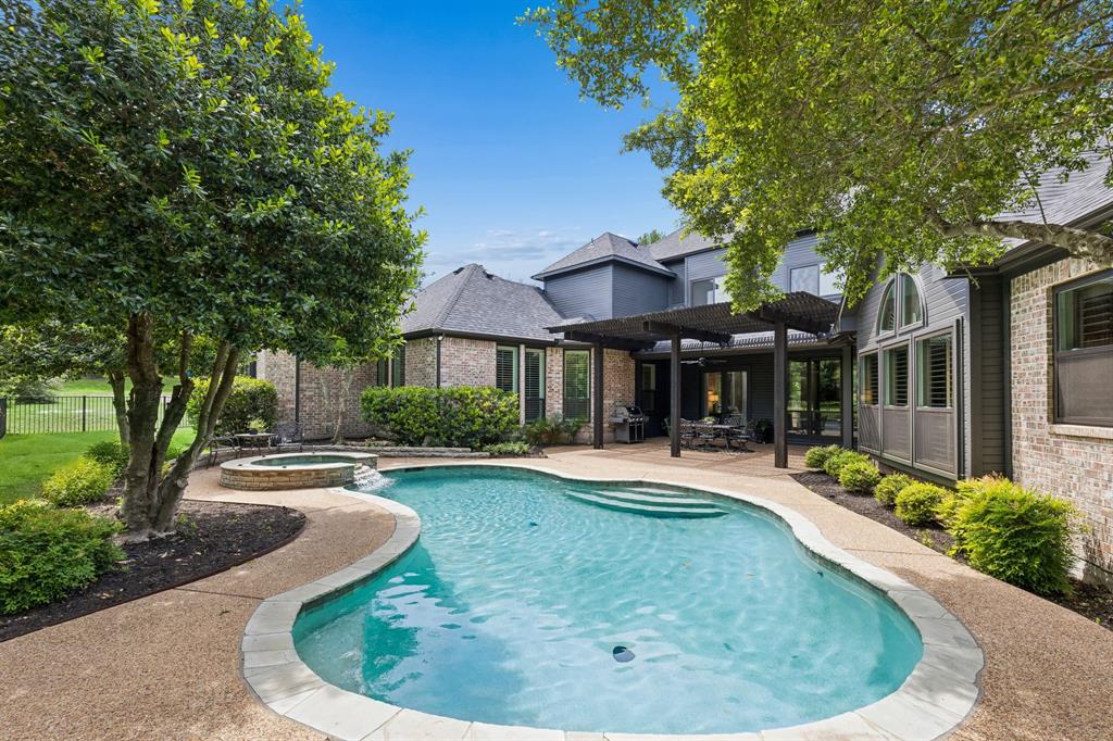 310 Deer Path Fairview, TX 75069 - Photo 3 of 40 Backyard retreat with pool, patio, and multiple areas to relax or entertain surrounded by mature trees for complete privacy.