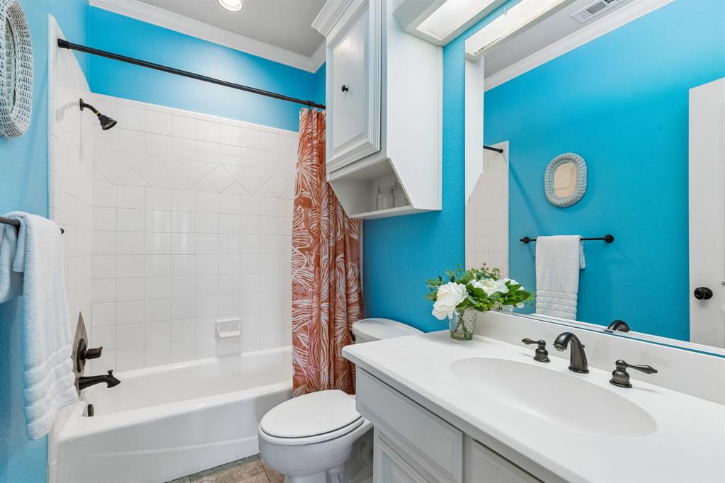 310 Deer Path Fairview, TX 75069 - Photo 29 of 40 a bathroom with a sink toilet and shower