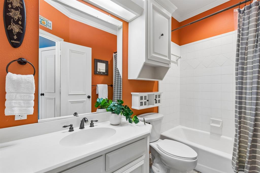310 Deer Path Fairview, TX 75069 - Photo 31 of 40 a bathroom with a sink a toilet and shower