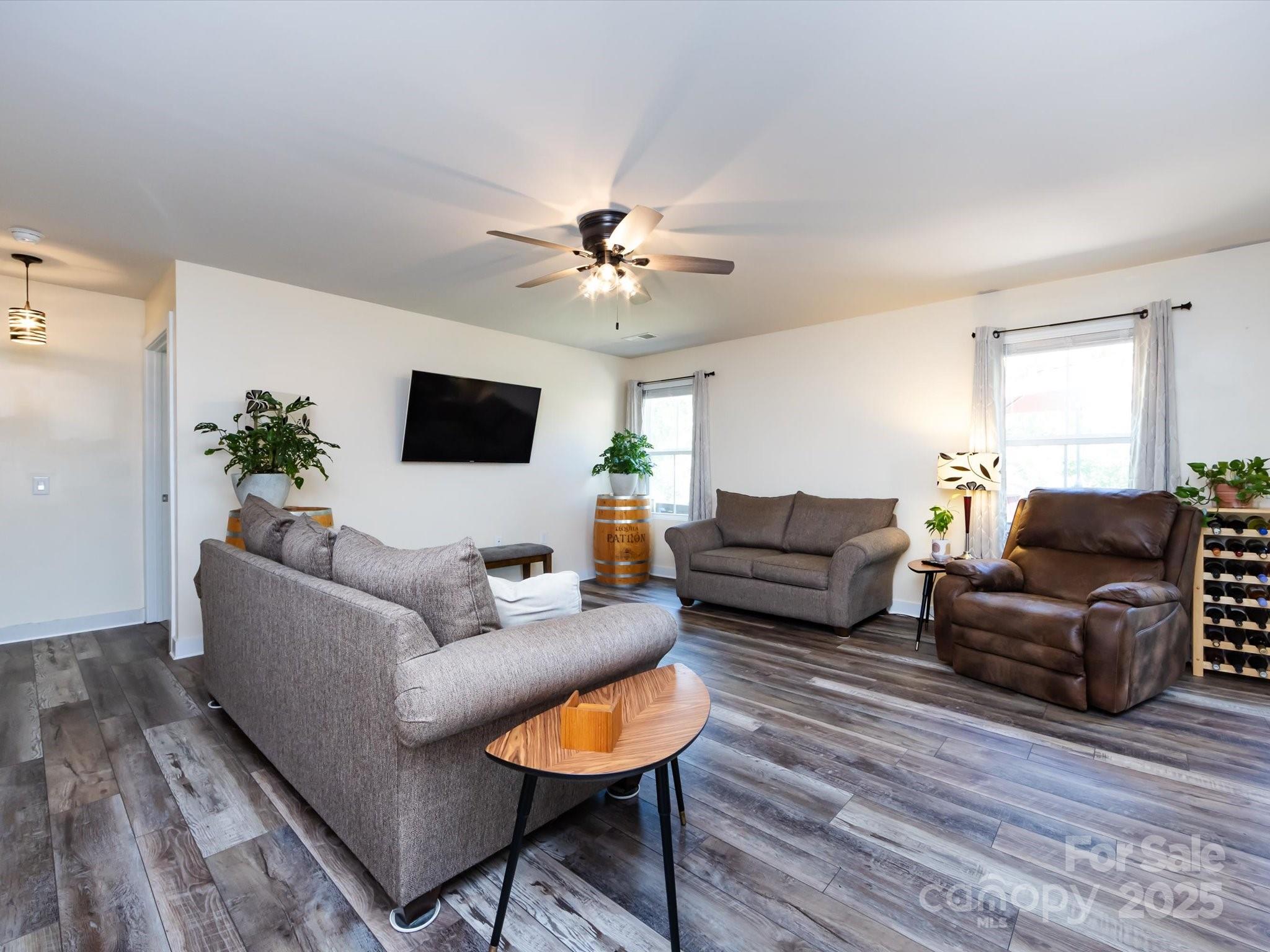4499 Hunton Dale Road Northwest Concord, NC 28027 - Photo 11 of 43 a living room with furniture and a flat screen tv