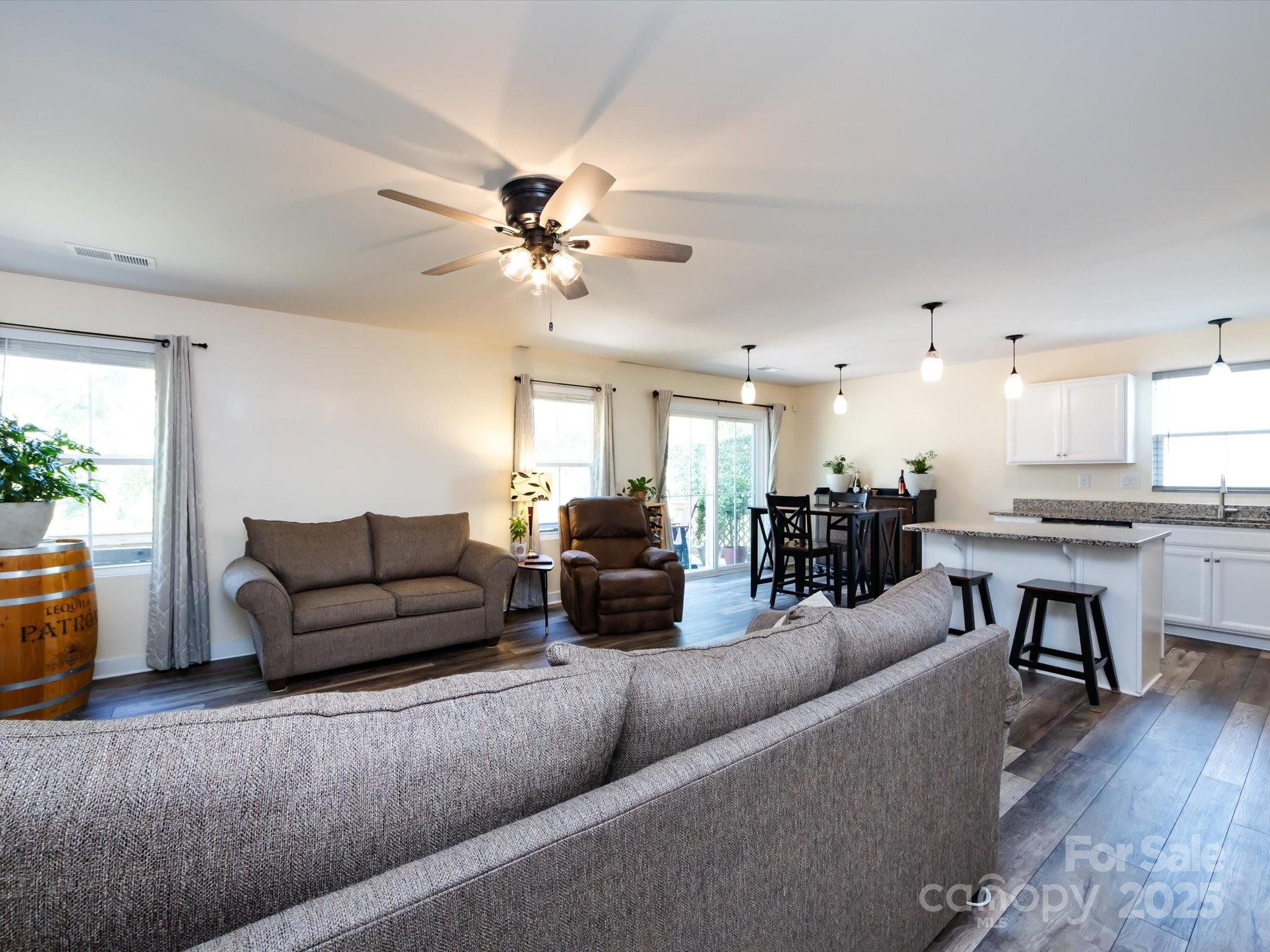 4499 Hunton Dale Road Northwest Concord, NC 28027 - Photo 13 of 43 a living room with furniture and kitchen view
