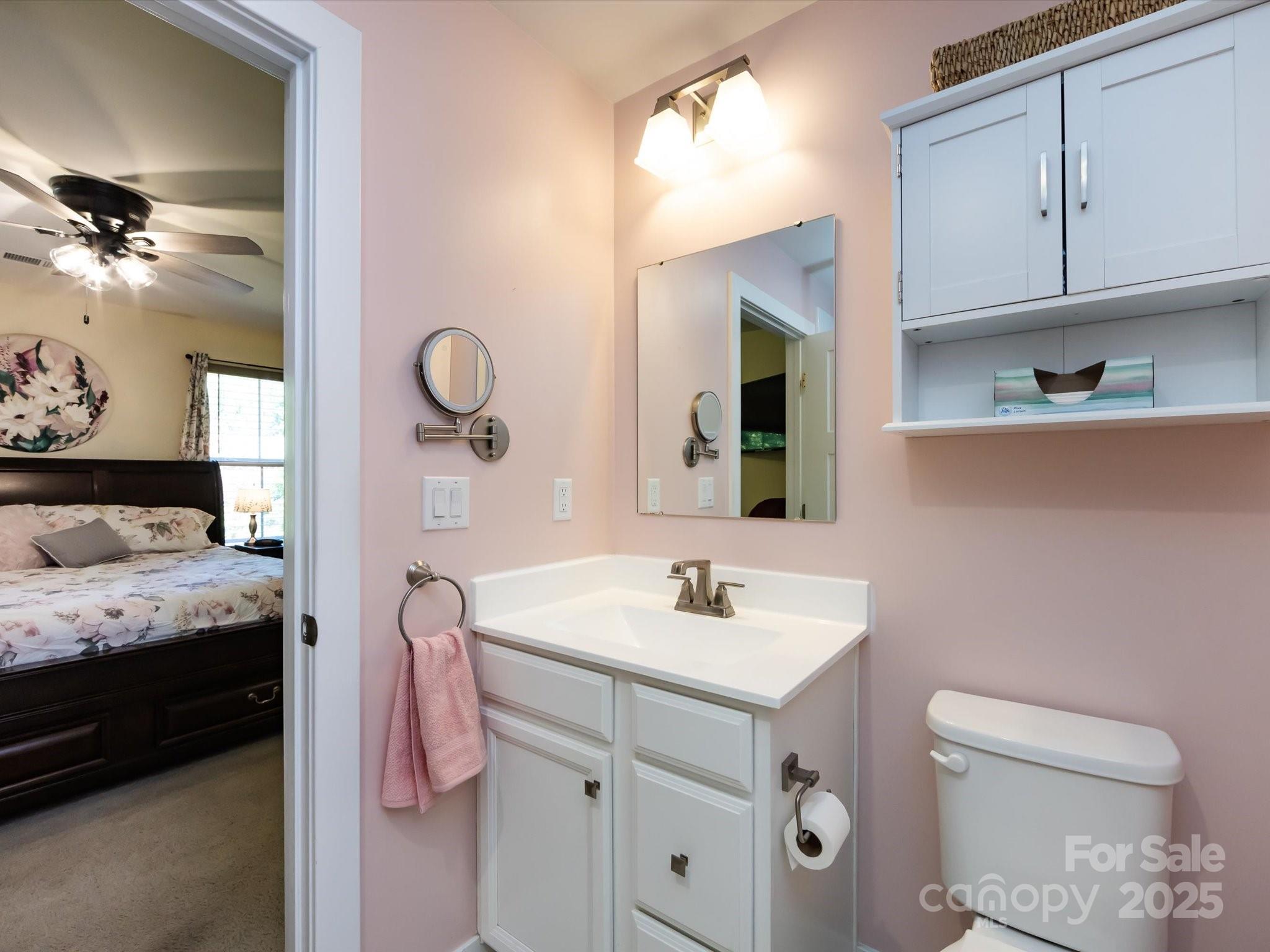 4499 Hunton Dale Road Northwest Concord, NC 28027 - Photo 29 of 43 a en suite bathroom with a granite countertop sink and a toilet