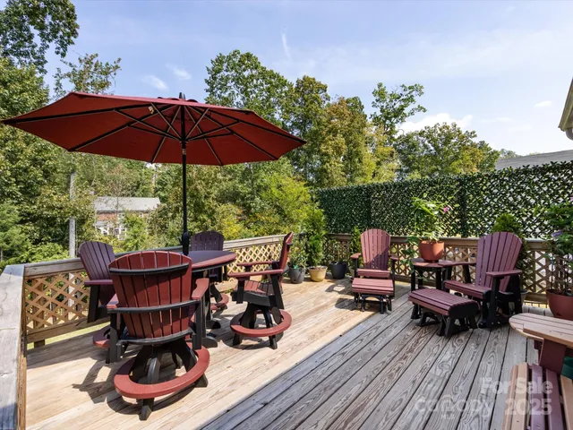 a view of a patio with a table and chairs