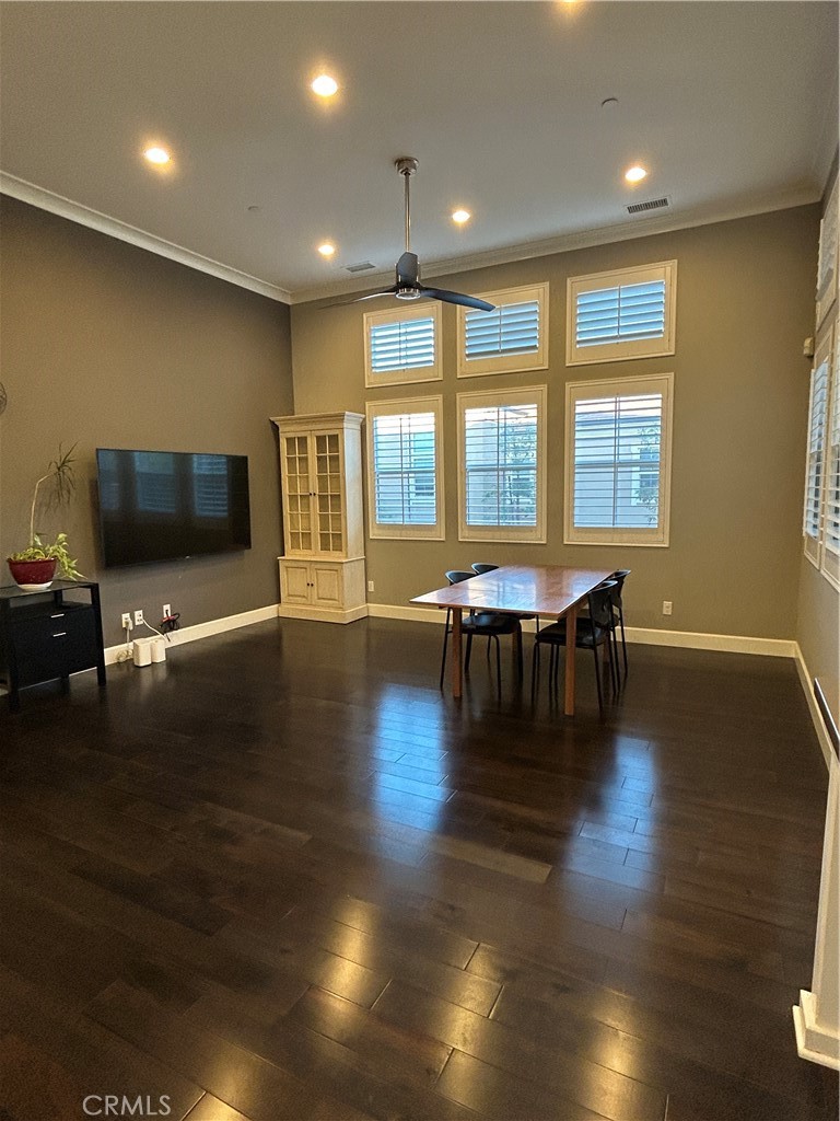 134 Rodeo Irvine, CA 92602 - Photo 2 of 23 a view of a livingroom with wooden floor and a flat screen tv