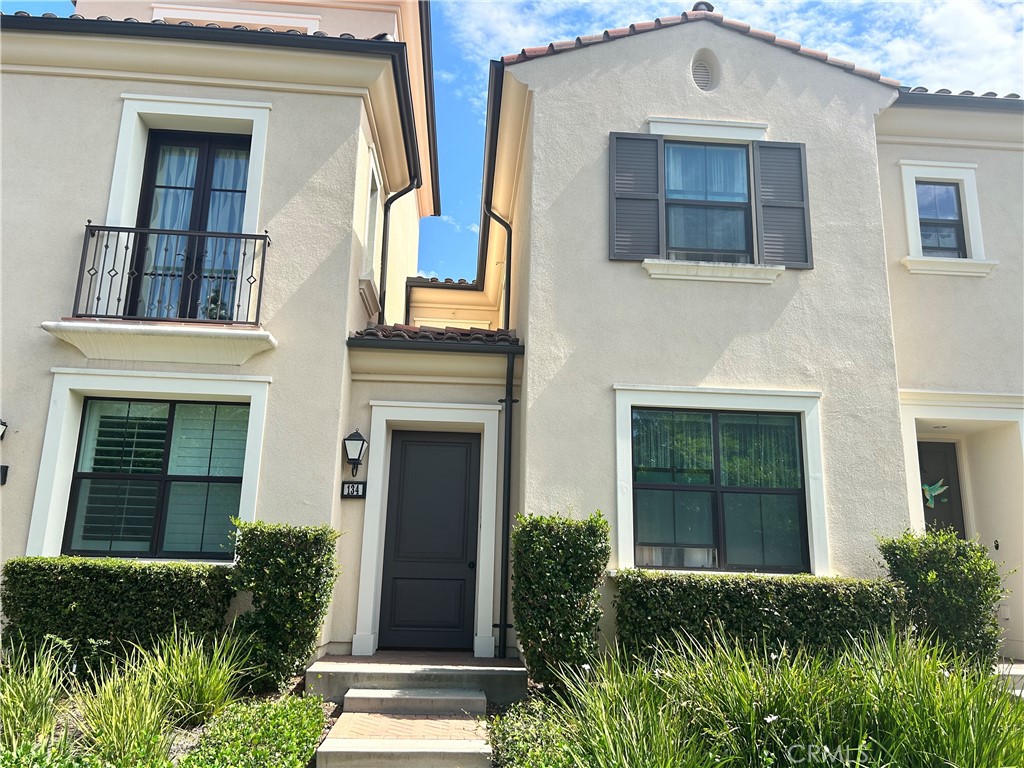 134 Rodeo Irvine, CA 92602 - Photo 22 of 23 a front view of a house with a yard