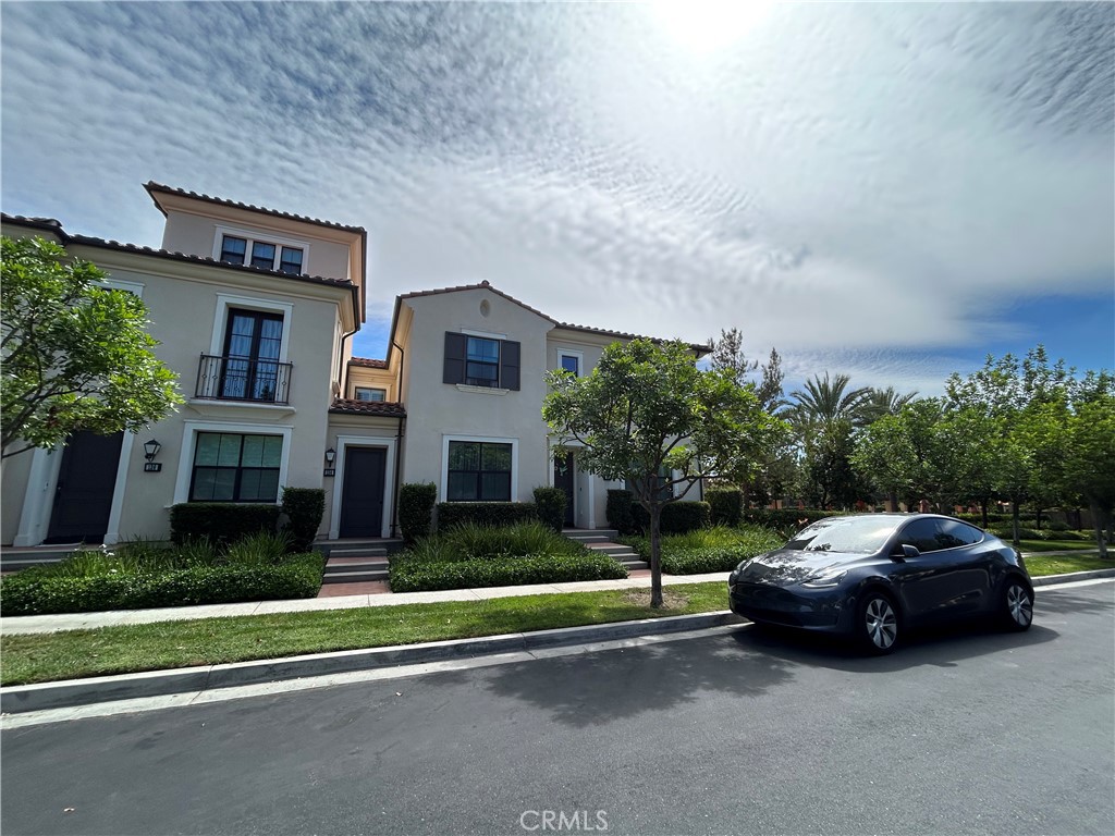 134 Rodeo Irvine, CA 92602 - Photo 23 of 23 a car parked in front of a white house